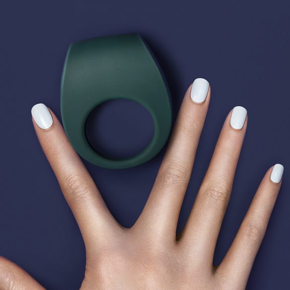 LELO Bo / Tor II cock ring between a person's fingers.