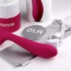 Minna Ola, a smooth slightly curved vibrator with a squeezable handle.