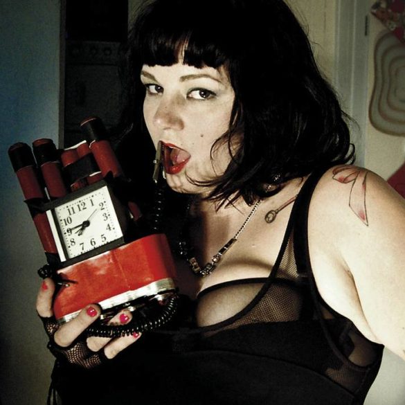 Courtney Trouble holding a time bomb.