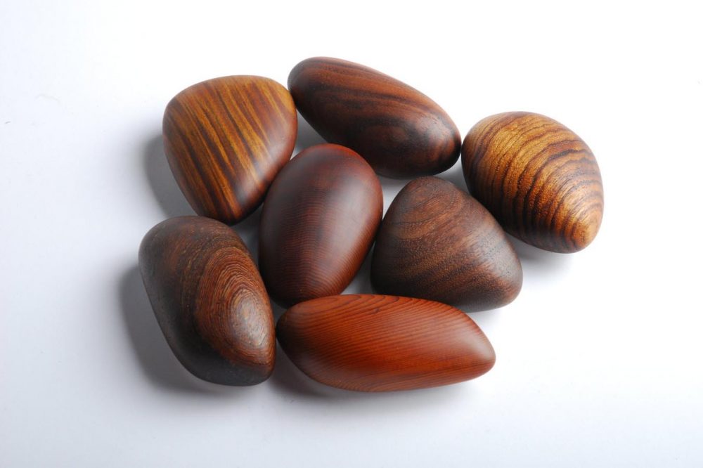 A bunch of pebble-shaped wooden objects.
