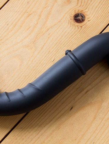 Ophoria Beyond 3 dildo on a wooden floor.