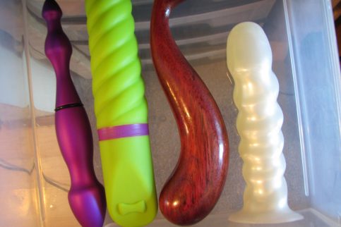 Drawer of sex toys, dildos and vibrators alike.