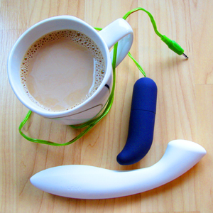 My avatar, featuring a coffee cup, the white LELO Ella G-spot dildo, and a purple bullet vibrator.