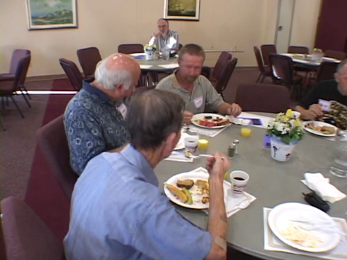 Old people eating breakfast.