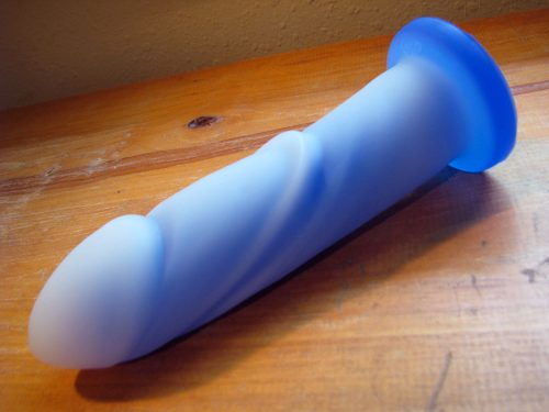 Tantus Cush O2 on a wooden table.