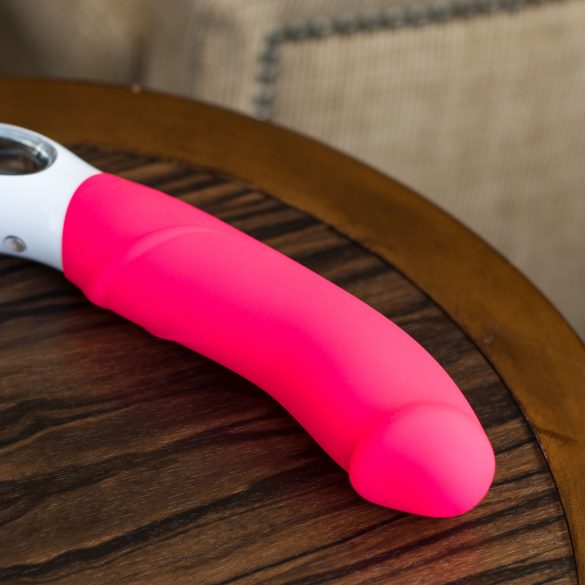 Fun Factory Big Boss G5 rechargeable vibrator on a wooden table.