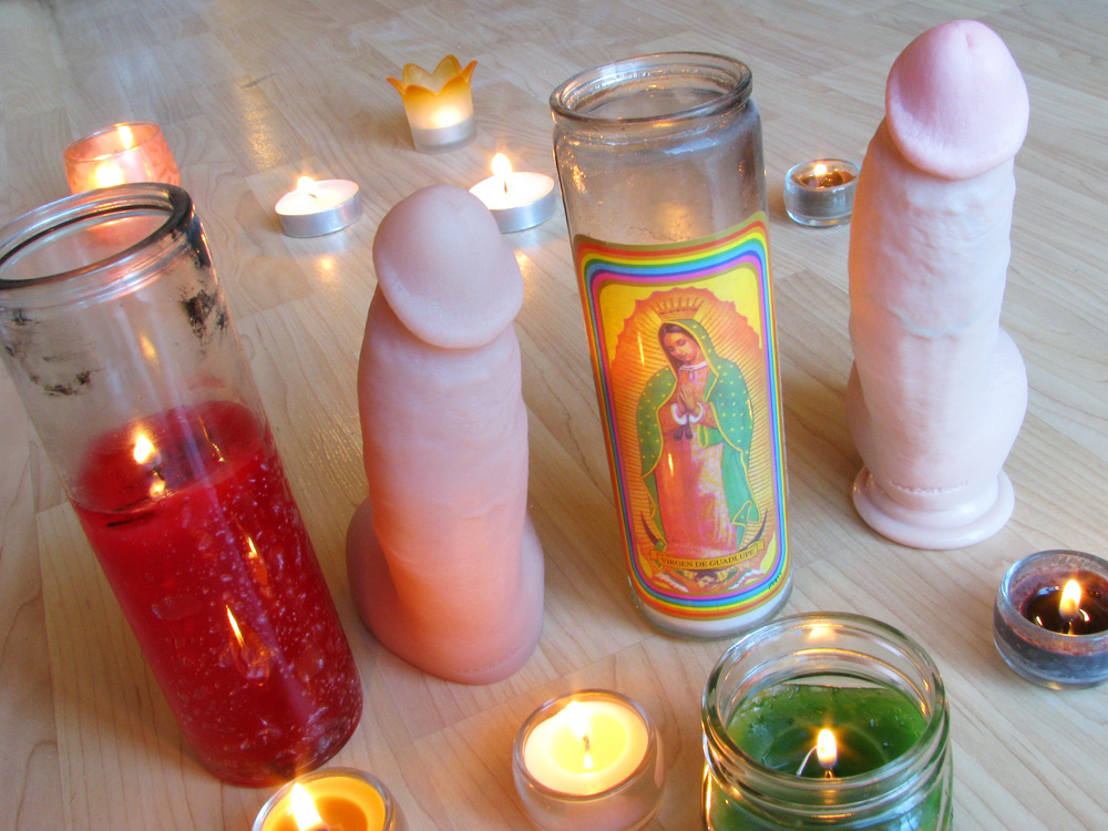 James Deen dildos, surrounded by candles.