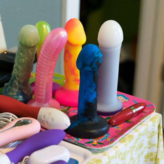 Silicone dildos standing upright and proud.