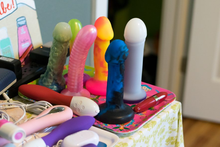 Silicone dildos standing upright and proud.