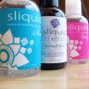 Bottles of Sliquid lined up: Sliquid Sea, Organics Gel, and Sassy.