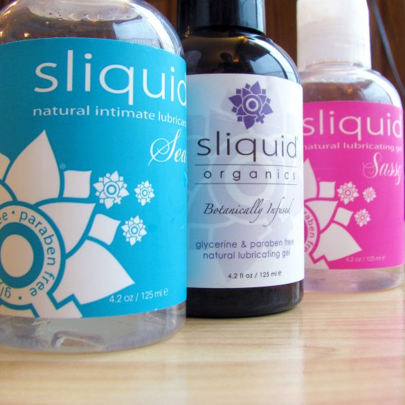 Bottles of Sliquid lined up: Sliquid Sea, Organics Gel, and Sassy.