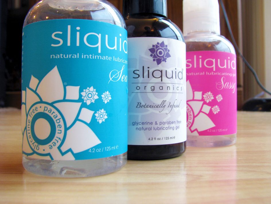 Bottles of Sliquid lined up: Sliquid Sea, Organics Gel, and Sassy.