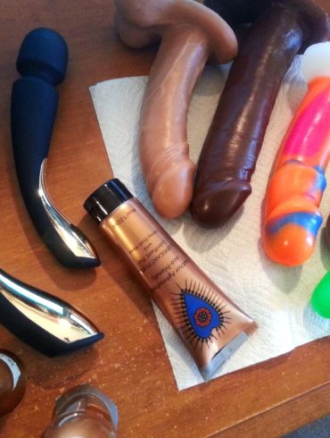 From above shot of my desk littered with the LELO Smart Wand vibrators and many Vixen dildos.