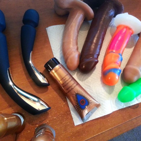 From above shot of my desk littered with the LELO Smart Wand vibrators and many Vixen dildos.