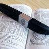 Lovehoney Flash USB rechargeable vibrator on top of a dictionary, open to the definition of "buzzy."