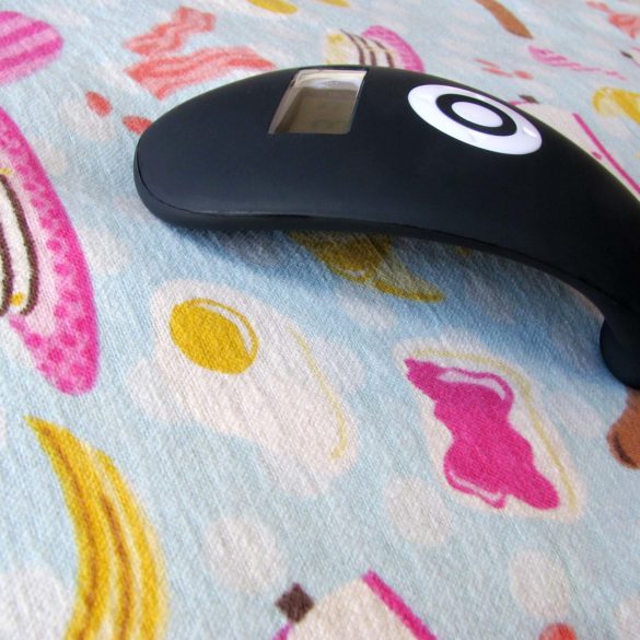 Wake-up Vibe on a pillow case patterned with breakfast foods.