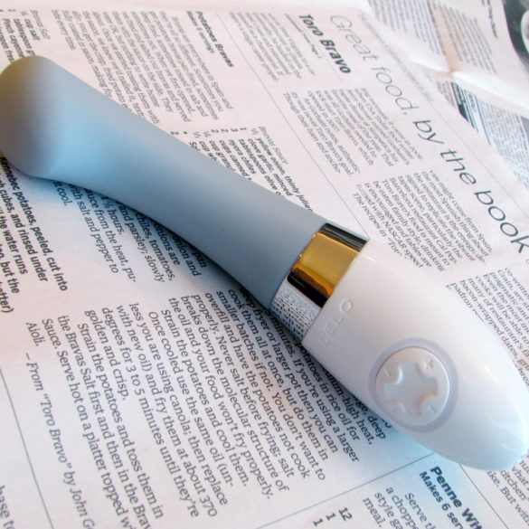 LELO Gigi 2 rechargeable G-spot vibrator on a newspaper.