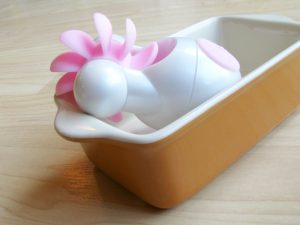 Lovehoney Sqweel Go oral sex toy in a tiny casserole dish