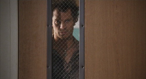 Kelly (Timothy Olyphant) in The Girl Next Door being fucking terrifying staring into a classroom through the window in the door.