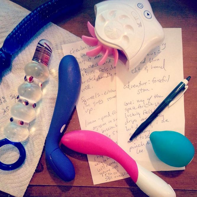 Sex toy masturbation session note taking, with dirtied toys lying on top.
