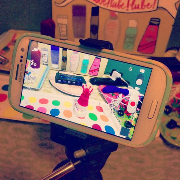 My phone filming the Vibratex Princessa on my not-at-all-staged charging station.