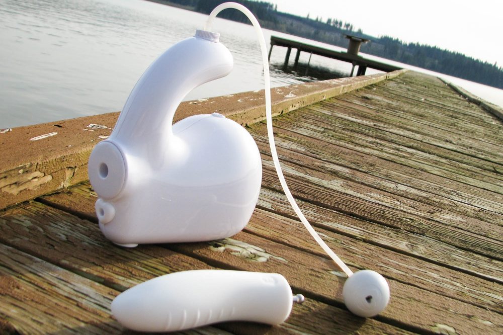 Bubble Love pleasure jet and Dilly dildo attachment on an old boat dock.