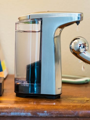 The simplehuman Sensor Pump on my nightstand, squirting lube onto my Pure Wand.
