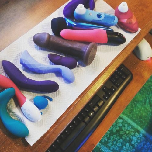 Smorgasbord of sex toys, and my cum towel on my desk chair.