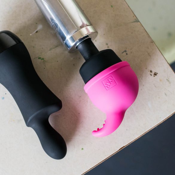 Doxy Don and Doxy Die Cast on a desk. The Nuzzle Tip attachment is on the Doxy Die Cast's head.