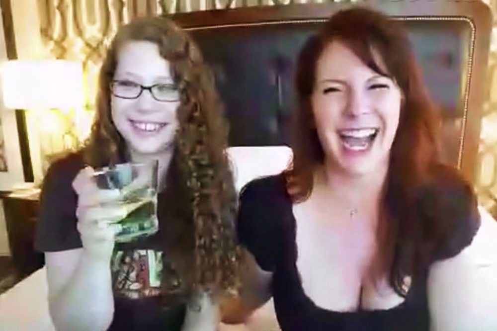 Me and Sandra from SheVibe, giggling in a hotel room with vulvaesque wallpaper.