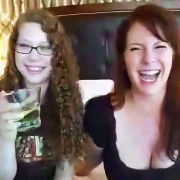 Me and Sandra from SheVibe, giggling in a hotel room with vulvaesque wallpaper.