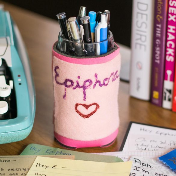 Typewriter, cup of pens, and some sex books. The sparkly "Epiphora" drink cozy on the cup was a gift from Bianca (TheVenusEmporium on Etsy). The other side has a vulva on it!