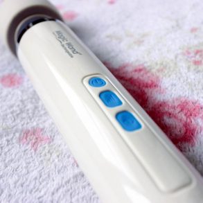 (Hitachi) Magic Wand Rechargeable vibrator on a fuzzy blanket.