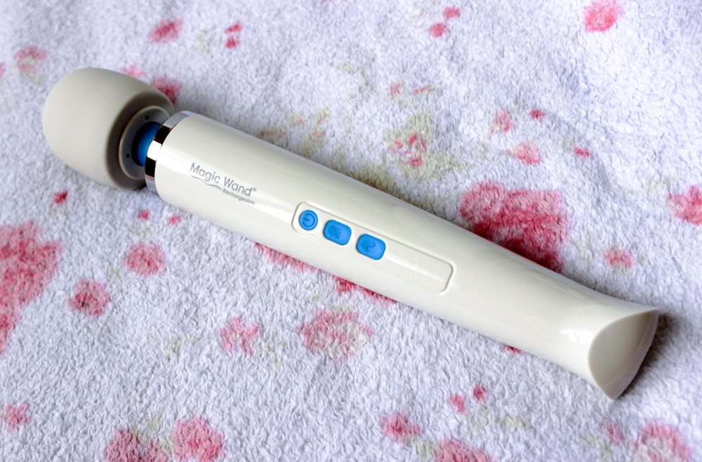 (Hitachi) Magic Wand Rechargeable vibrator on a fuzzy blanket.