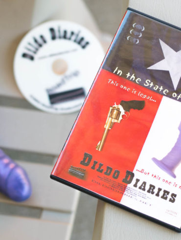 Dildo Diaries (2002). DVD sitting next to a purple dildo.