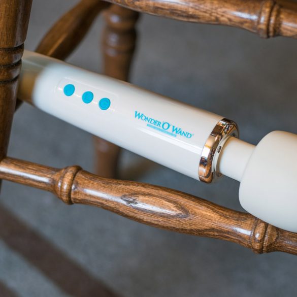 Wonder 'O' Wand balanced between the wooden legs of a stool.