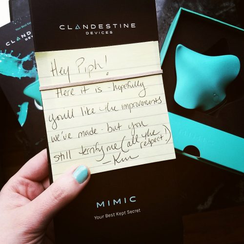 Unboxing of the Clandestine Devices Mimic vibrator, with a note which reads "Hey Piph! Here it is — hopefully you'll like the improvements we've made — but you still terrify me (all the respect!)"