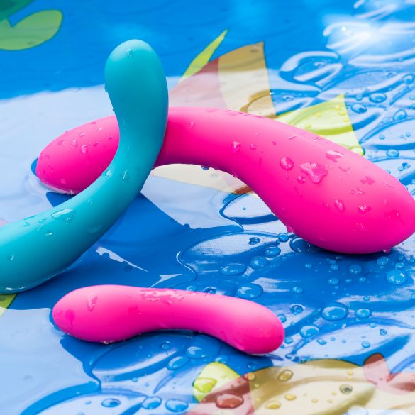 BMS Factory Swan Curve vibrator leaning against the Swan Wand, with Mini Swan Wand in foreground, in a kiddie pool.
