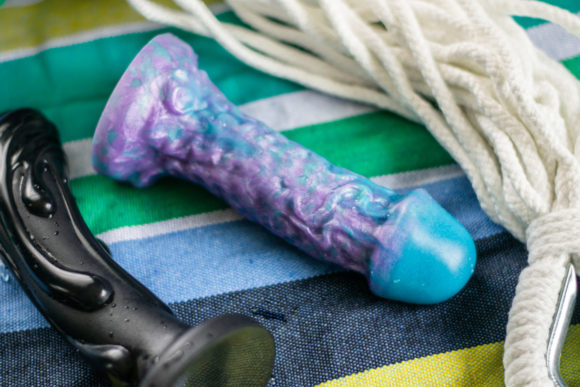 Tantus Magma (left) and Uberrime Jellyfish 2.0 silicone dildos.