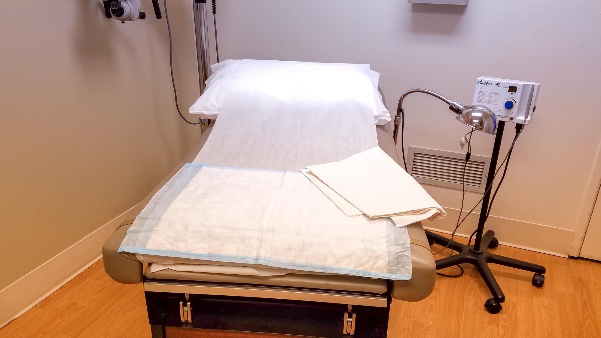 Exam table at the doctor's office, lined with crunchy-looking paper.