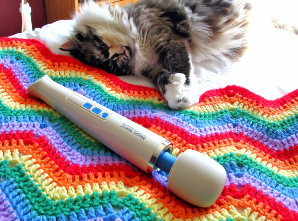 Tessa sleeping in bed with the Hitachi Magic Wand Rechargeable.