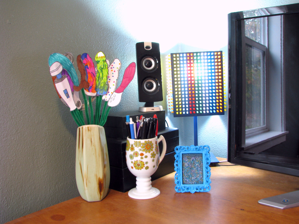 My uncluttered sex blogging desk, complete with knitted vulva.