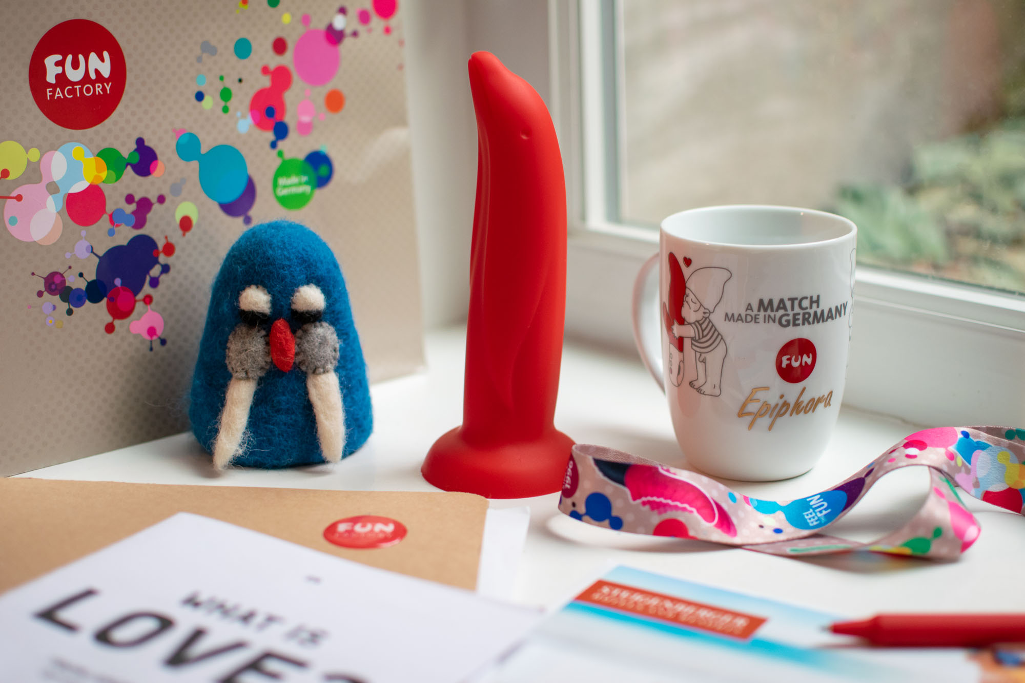 Dolly Dolphin dildo and Epiphora mug with other trinkets from Fun Factory in Bremen, Germany.