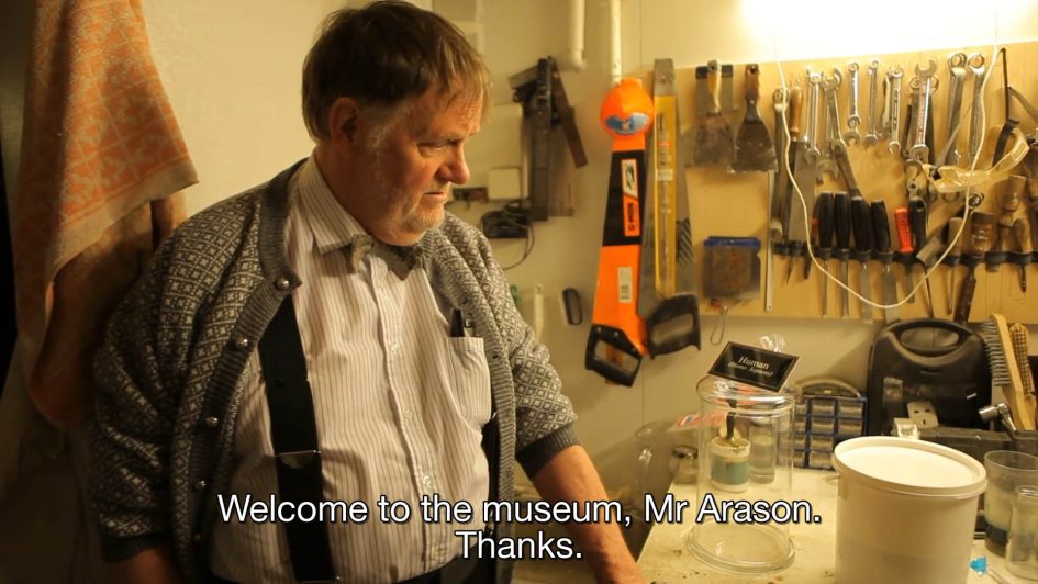 Siggi looking at the bucket. Caption reads: "welcome to the museum, Mr. Arason. Thanks."